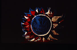Slide of stained glass panel with sun