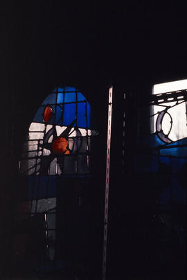 Slide of detail on windows with red flames