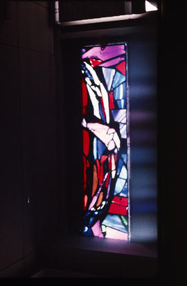 Slide of red and blue stained glass panel